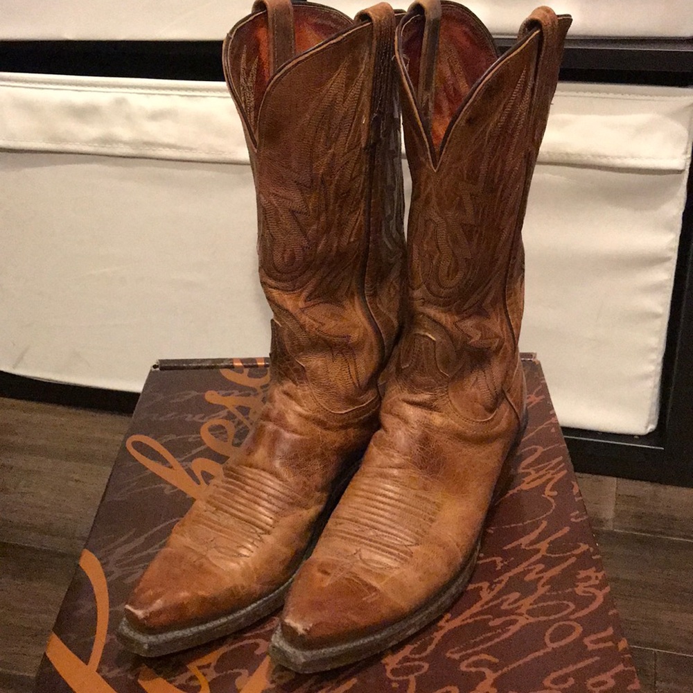 Brown Lucchese 1883 cowboy boots.